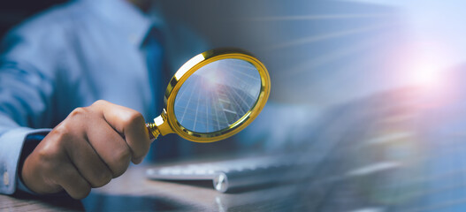 Businessman search Information by magnifying glass. Search Engine Optimization(SEO).