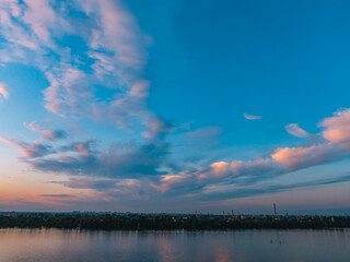 Fototapeta na wymiar A beautiful sunset or dawn sky from a height above the city. Dnipro.Ukraine. Background picture. Dramatic evening cloud landscape in the city. Drone photography. Ukrainian city