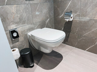 Modern toilet in the bathroom. The bathroom overlooks the closed toilet. New ceramic white toilet...