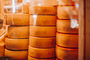 Cheese on a store window. Christmas market in Europe, Italy, Milan 27.12.2023