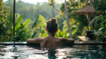 Back View of Poolside Relaxation: Rear view of a person enjoying a peaceful moment at the edge of a serene pool