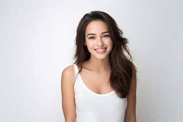 Sweet young girl dressed in comfortable vest undergarments, exuding confidence as she poses gracefully on a pristine white surface. Generative AI.