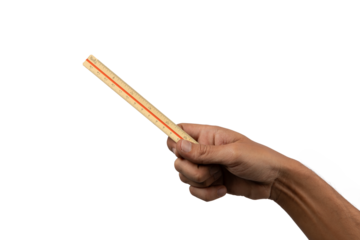 Black male hand holding a vintage or antique ruler isolated no background