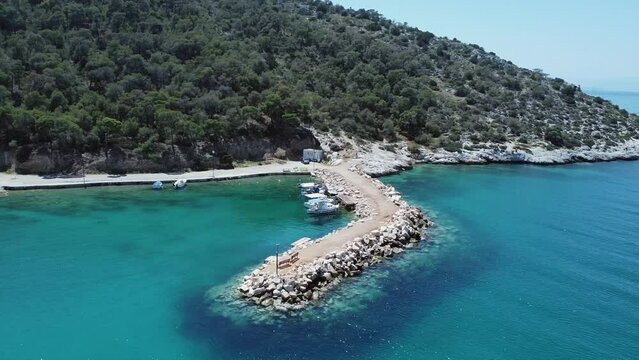 Small fishboat port in a greek village aerial footage