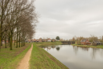 external perimiter of historic Holland fortified town Nieuwpoort. Star shaped walled city near river Lek part of Old Dutch Waterline defense from flood water and enemies safeguarding inhabitants 
