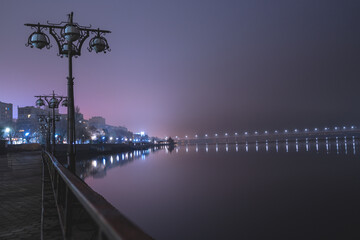 Scenic view of the city of Dnepr in the winter evening. Dnipro in the evening. Ukrainian city in...
