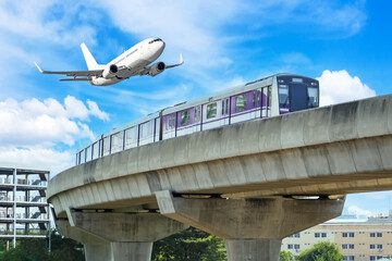 View railway track suburban subway electric train rushing to . Passenger plane flying in sky, take...