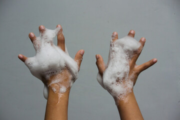 Little child's hands with foam