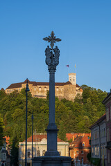 Holy Trinity Column And Ljubljana Castle In Slovenia - 733715907