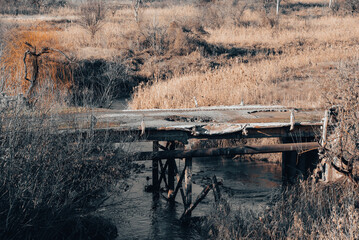 destroyed bridge across the river in Ukraine