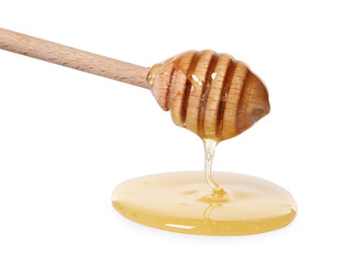 Natural honey dripping from dipper on white background