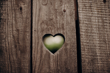 Heart shape carved on wood. Symbol of love, Valentine's Day, Saint Valentine