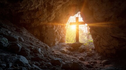 A sunlit cross in a cave. Symbol of hope and faith in Jesus Christ resurrection