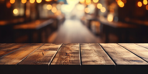Empty wooden table with blurred background of beer bar or beer cafe.