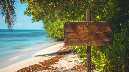 Wooden signboard on a tropical beach