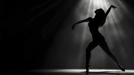 Grace in the Dark, A Woman Dance against the Black Canvas - obrazy, fototapety, plakaty