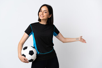 Young football player woman isolated on white background extending hands to the side for inviting to come