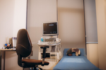 gynecological chair in a light gynecologist's office.
