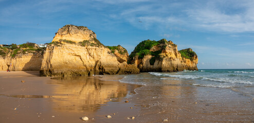 Spectacular sea stacks and rock formations in the Praia dos Três Irmãos (three brothers) beach,...