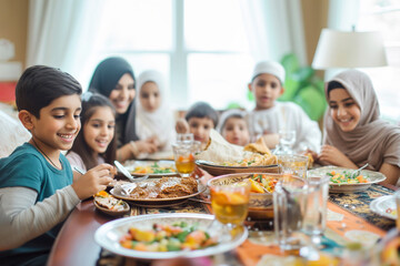Big family shares in sustenance that nourish body and soul. Muslim family finds solace and strength in shared faith and traditions at table