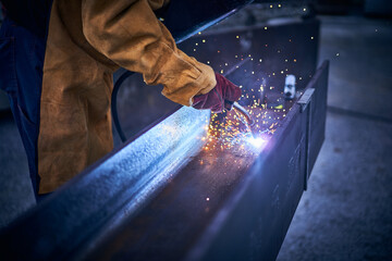 
Industrial worker doing welding on iron