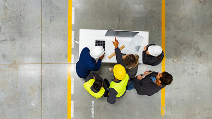 Top view of full team of warehouse employees in warehouse. Team of workers, managers, female...