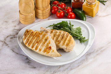 Grilled chicken breast served arugula