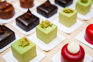 Various colorful sweet deserts pastry in bakery