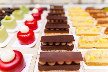 Various colorful sweet deserts pastry in bakery