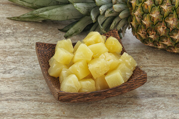 Marinated pineapple slices in the bowl