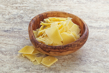 Sliced parmesan cheese heap in the bowl