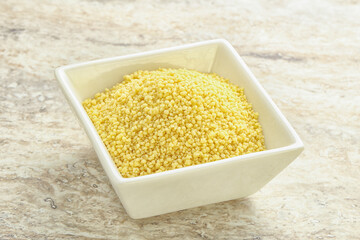 Raw couscous in the bowl