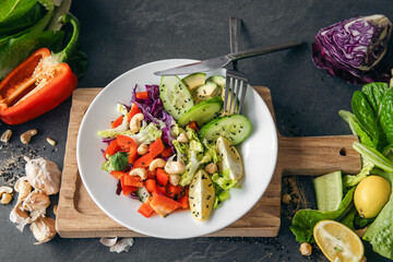 Close-up, fresh vegetable salad on the kitchen table.