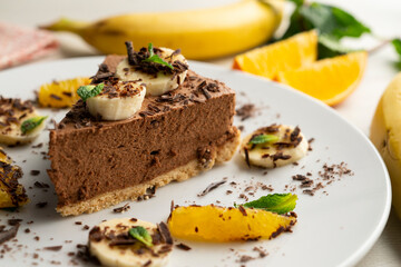 Delicious and fluffy chocolate mousse cake with banana and orange aroma.