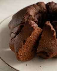 Delicious and fluffy round chocolate cake with cashews and raspberries.