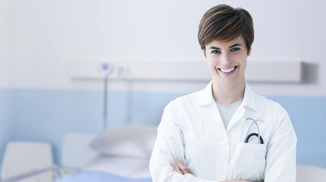 Smiling female doctor posing in a hospital room