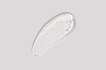 Skin care gel, face serum, lotion swatch smear on white background.