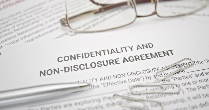 Blue pen on a confidentiality and non-disclosure agreement form. A confidentiality and non-disclosure agreement form safeguards sensitive information, outlining obligations, exceptions, and remedies.