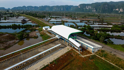 View of a train station and rice fields in the countryside in, Indonesia