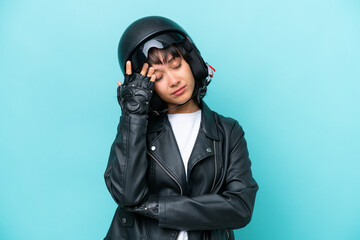 Young Argentinian woman with a motorcycle helmet isolated on blue background with headache