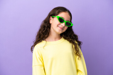 Little caucasian girl isolated on purple background