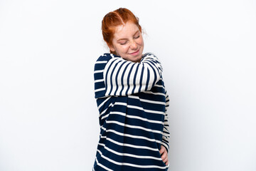 Young reddish woman isolated on white background suffering from pain in shoulder for having made an effort