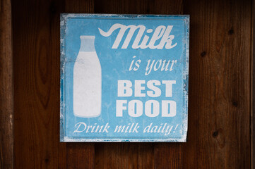 Obraz premium milk is your best food vintage sign real photo