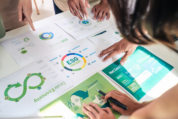 diversity team brainstorming focused on ESG (environment,social,governance)  for sdgs goals in a sustainable green office - 733817758