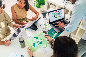 diversity team brainstorming focused on ESG (environment,social,governance)  for sdgs goals in a sustainable green office - 733817761