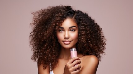 closeup of beautiful young model woman with curly hair holding bottle of shampoo or conditioner hair product. Mock up, advertising for care and beauty hair product. Concept promotion cosmetic product - obrazy, fototapety, plakaty