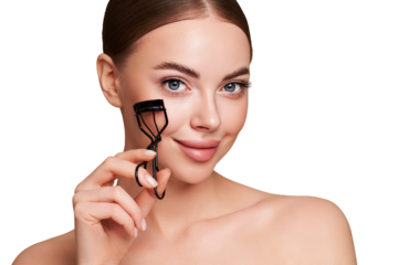 Close up of a beautiful young woman curling her eyelashes. Eyelash extensions