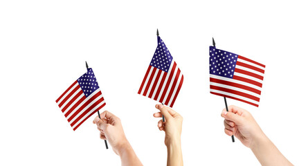 A group of people are holding small flags of USA in their hands.