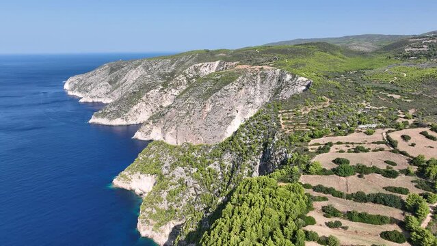 Drone viewpoint of Cliffs of Kambi in Zakinthos Greece Island. Beautiful cliff coast on greek island. Wild cliffs of the western Zakynthos. Vacation turquoise sea and green rock cliffs on the island. 