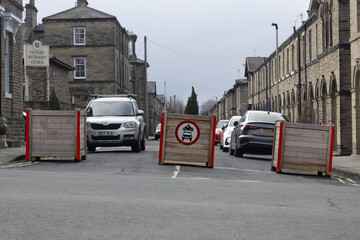 Solid planters have been installed across junctions in Saltaire in Yorkshire to restrict traffic in...